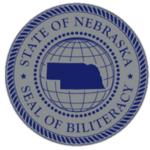 the silver seal has an outline of the Nebraska map with the world around it on a silver background with blue highlights